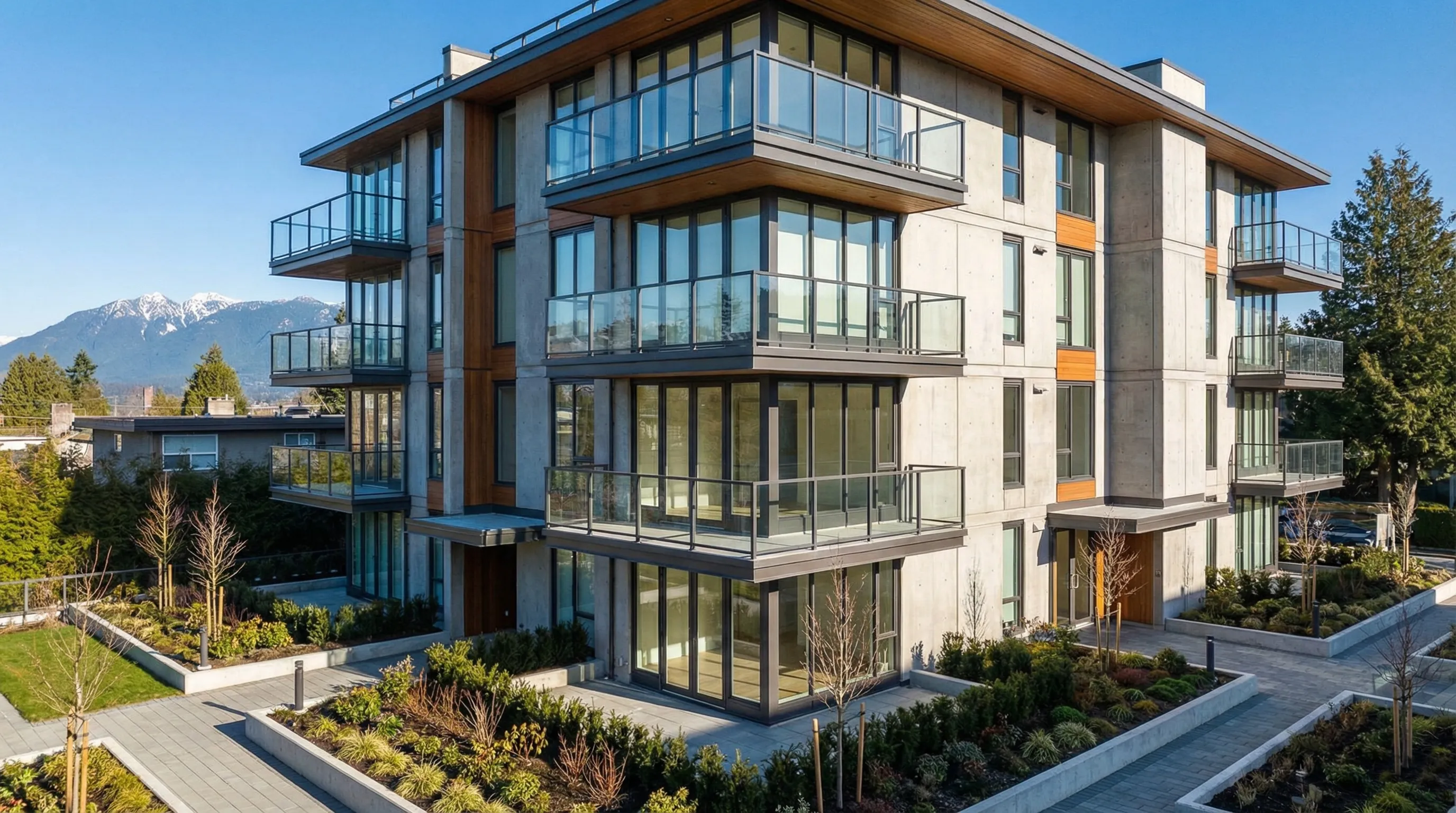 Modern newly constructed condo building in Vancouver with mountain views
